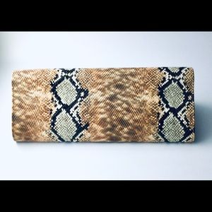 Beautiful multi colored Faux snakeskin clutch.
